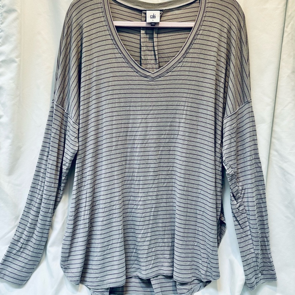 CAbi Women's Plum Tee purple stripes are cast against a warm gray.